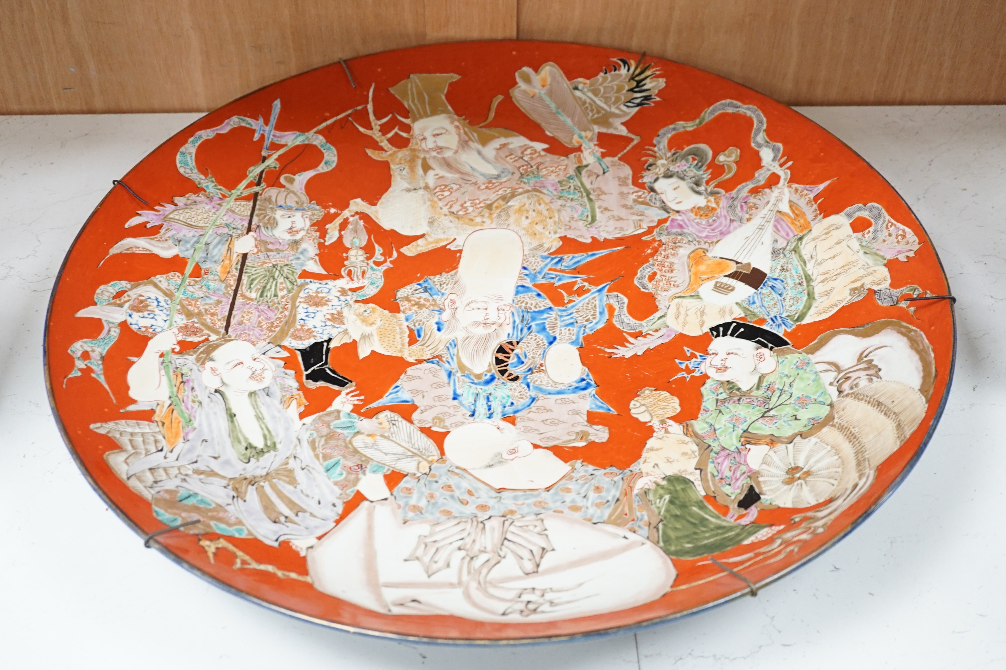 A massive Japanese Arita 'Seven Gods of Happiness' dish, Meiji period, 60.5cm.